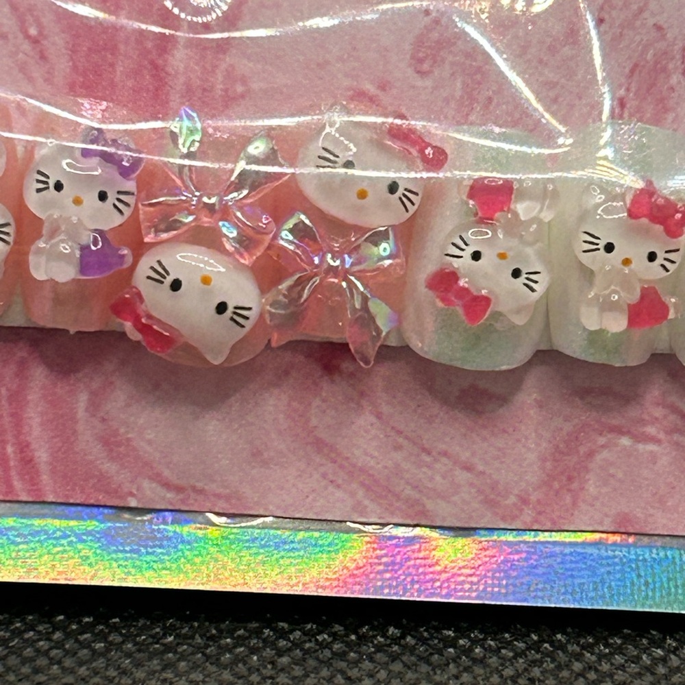 Hello Kitty press-on nails by Sami’s Manis